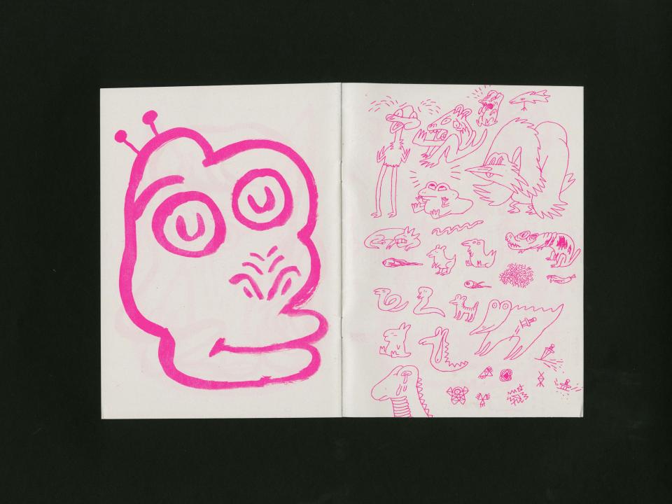 pink drawing of head and writting