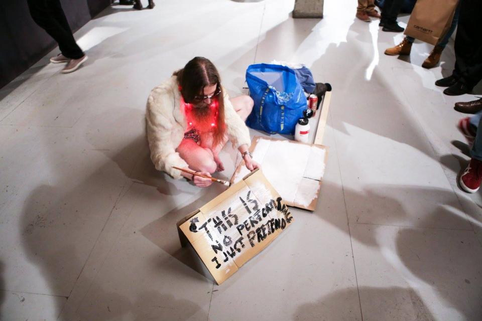 Man sitting on the floor, preparing for his performance