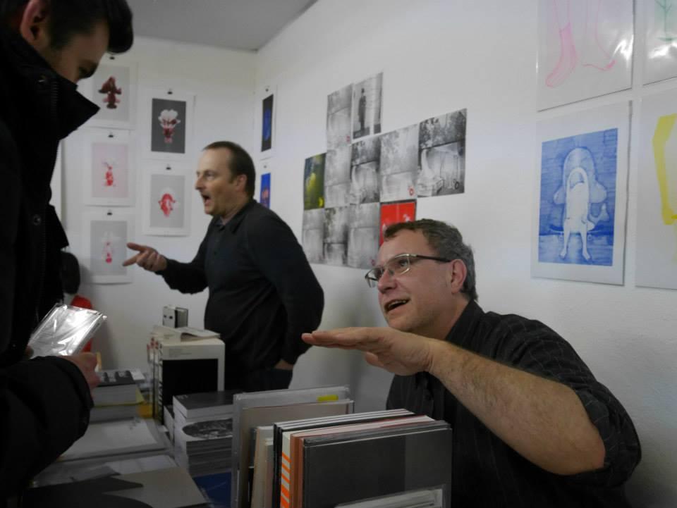 Publishers explaining their books at their tables