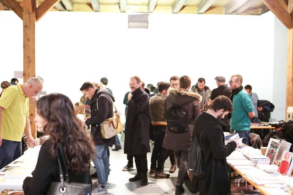 © Spyros Paloukis Room full with people and book stands