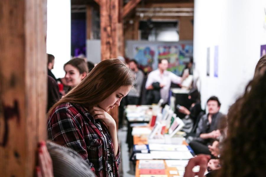 People looking at book stands