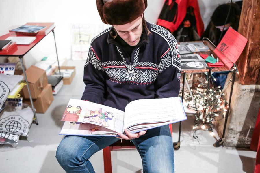 Guy looking at a book