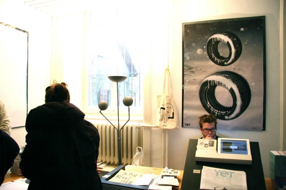 © ALF Picture of a book stand and a big poster behind it on the wall