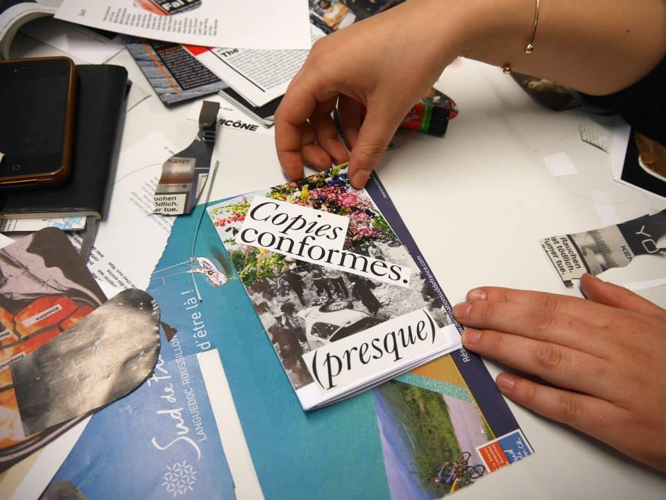 A person is making a collage on a table