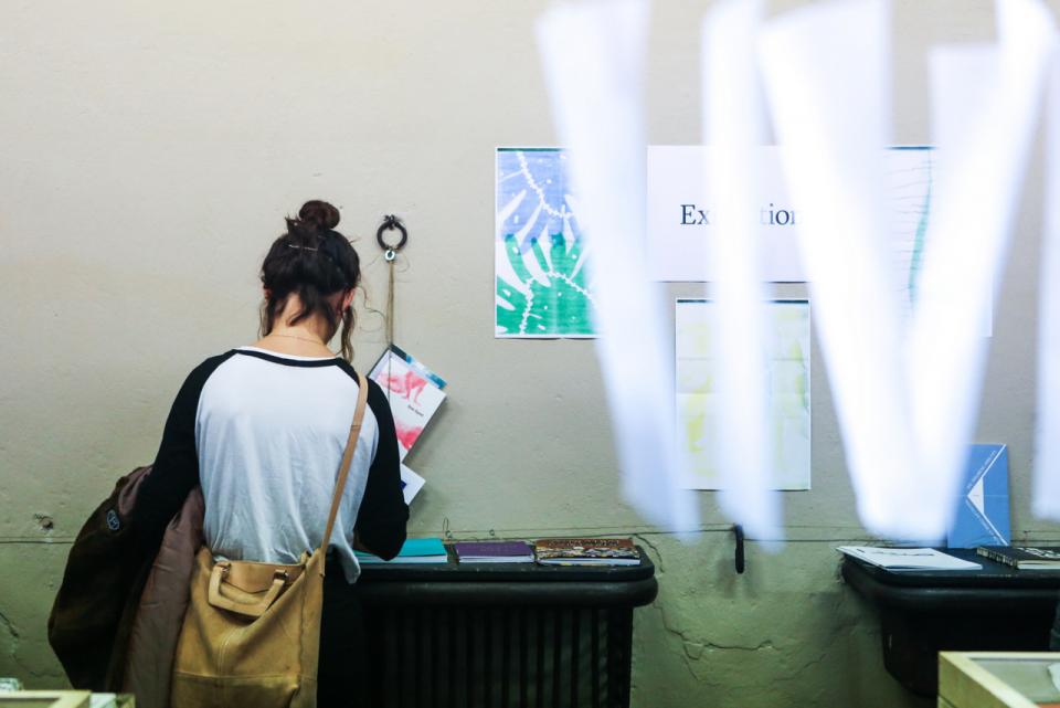 Girl looking at the book exhibition