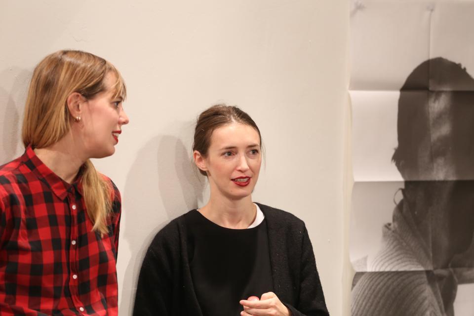 Two girls talking to each other