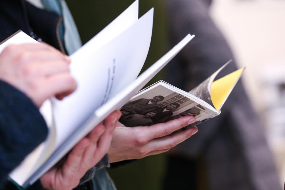 Person with book in hands