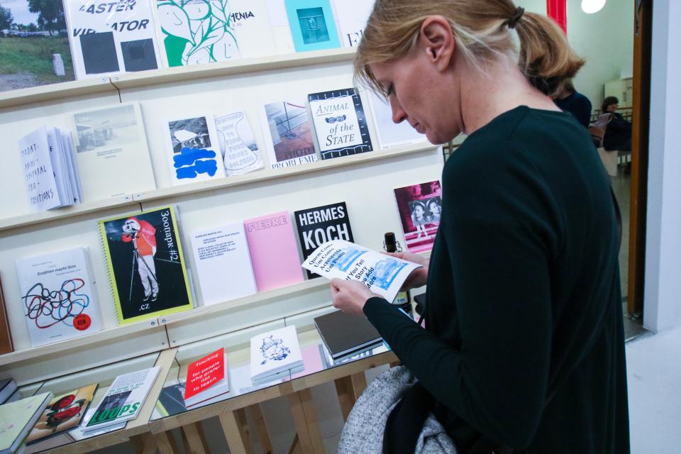 Woman looks at books