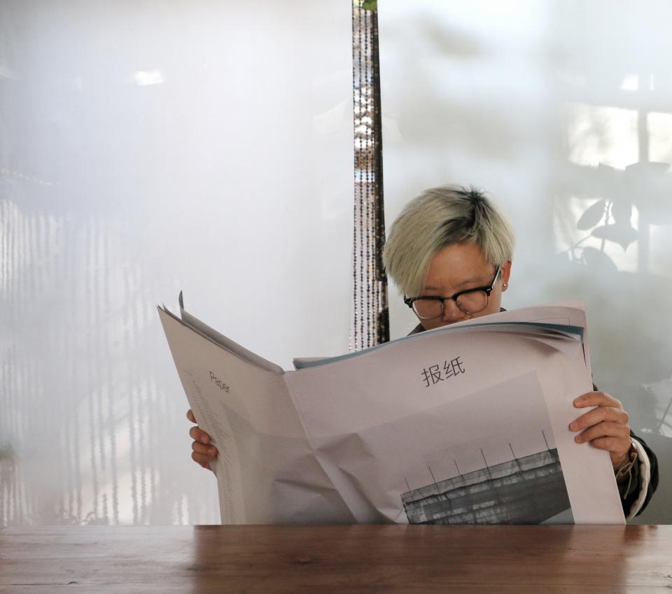 Reading newspaper